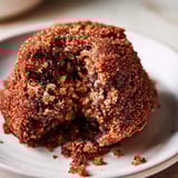 Freshly baked Soft Molasses Cookies, beautifully crinkled, offering that rich flavor and scent of the holiday season.