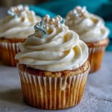 Elegant Cancer Birthday Cupcakes with delicate buttercream and pearl fondant accents presented beautifully.