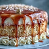 Indulgent rosé velvet cake boasting a cascade of edible gold, perfect for celebrations.