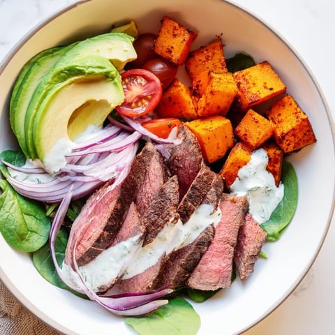 A colorful Beef Avocado Sweet Potato Bowl with tender beef and creamy avocado, ready to enjoy.