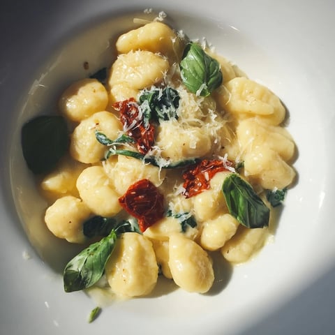 Creamy Tuscan Gnocchi: A comforting skillet of pillowy gnocchi with spinach, sun-dried tomatoes, and rich Parmesan cream.