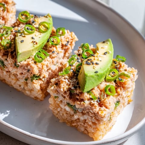 Golden, crispy squares of spicy tuna crispy rice topped with creamy tuna and avocado, ready to eat.