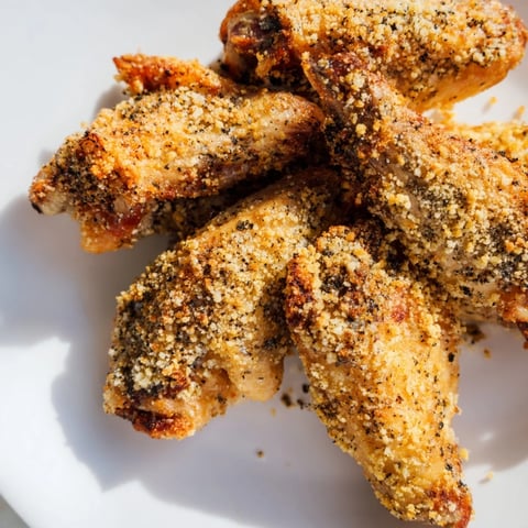 Golden, crispy Baked Parmesan Chicken Wings, ready to serve and perfect for game day snacking.