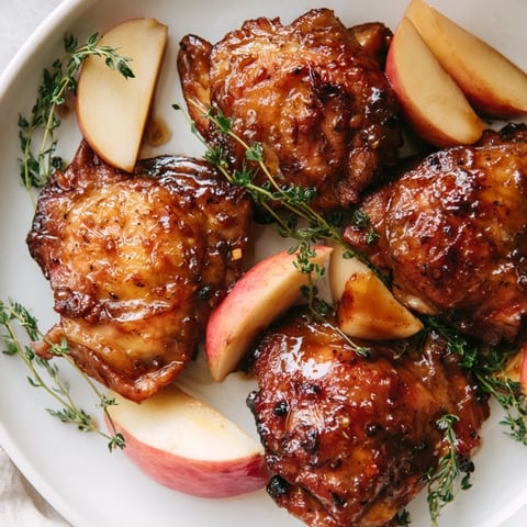 Golden-brown Sticky Maple Apple Chicken, glazed and glistening, with tender apples baked alongside.