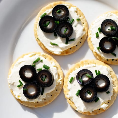Bright, colorful Gold Medal Olympic Ring Appetizers featuring creamy cheese and fresh, diced vegetables.