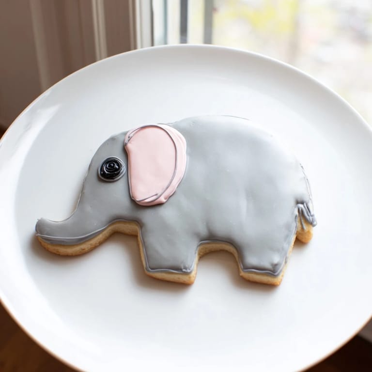 Freshly baked Biscuits Amical Éléphant Géant sugar cookies, jumbo, shaped as elephants, ready for the perfect treat.