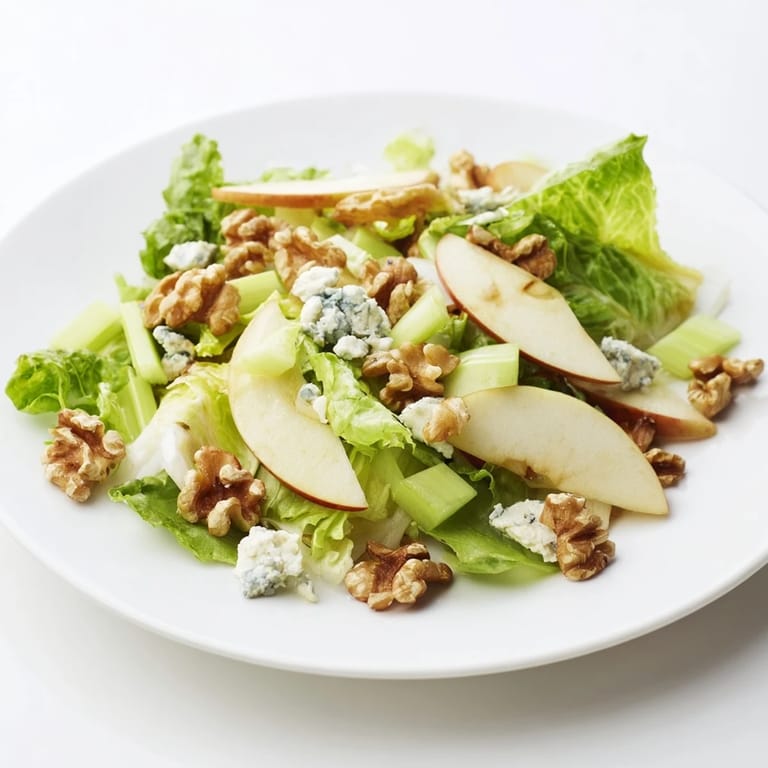 A vibrant bowl of Apple and Walnut Salad featuring crisp apple slices, toasty walnuts, and a tangy vinaigrette.